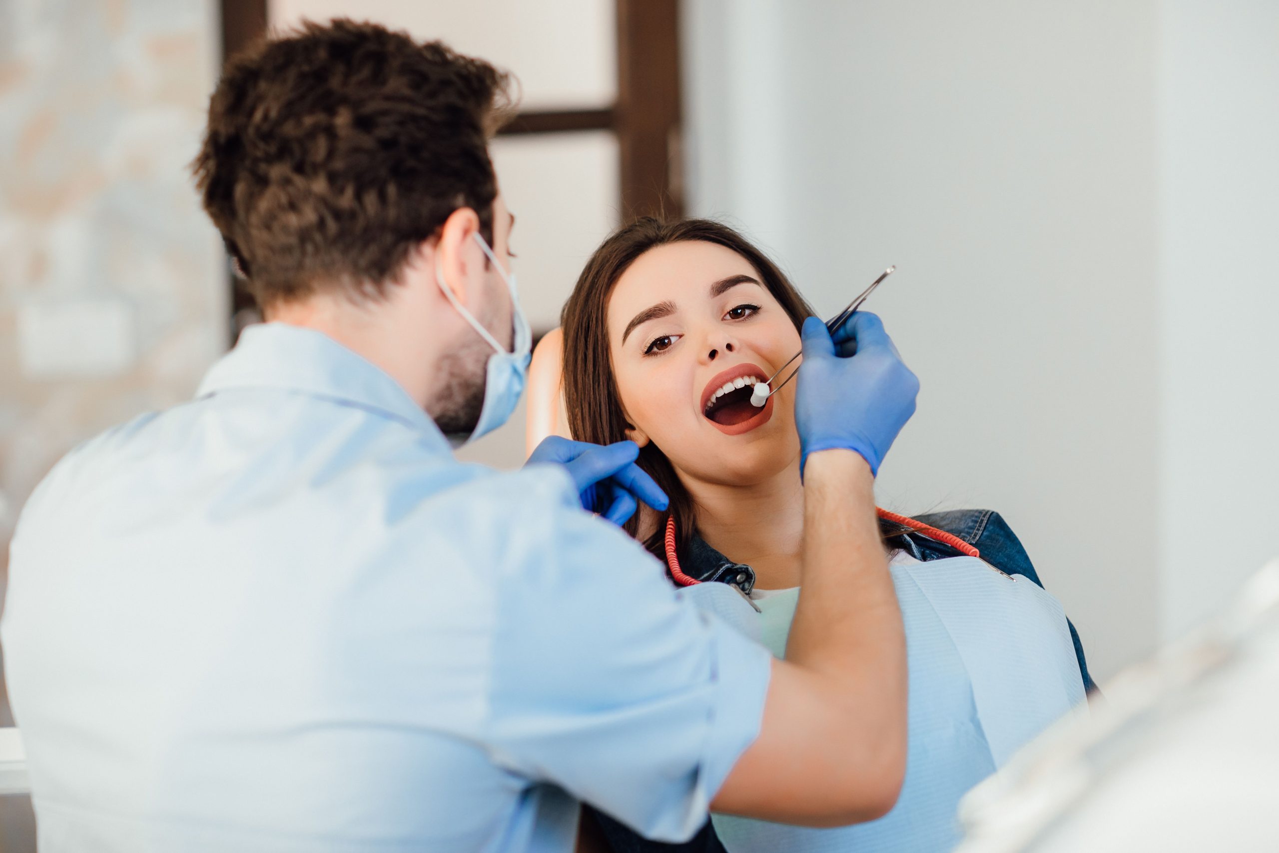 What dental hospital in Varanasi charges for Dental Implants?